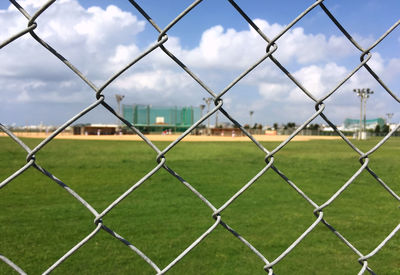 Field seen through chainlink fence