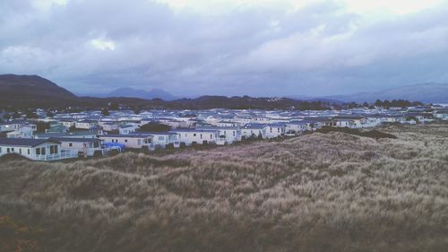 Scenic view of mountains against cloudy sky