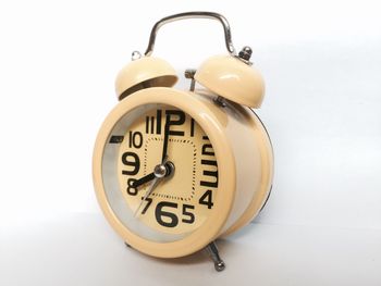 Close-up of clock on table