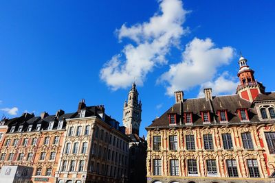 Low angle view of buildings against blue sky