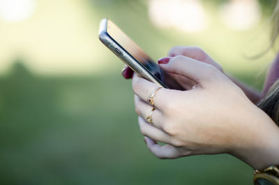 Close-up of man using mobile phone