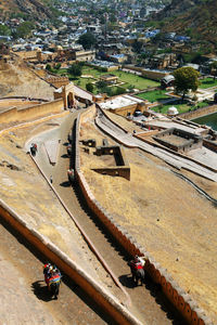 High angle view of fortified wall at amber fort on sunny day