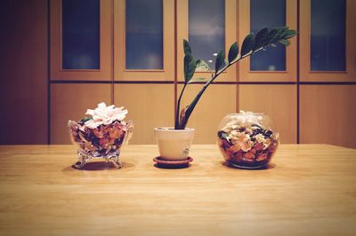 Close-up of flower vase on table at home