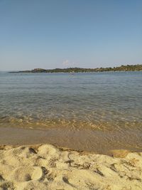 Scenic view of beach against clear sky