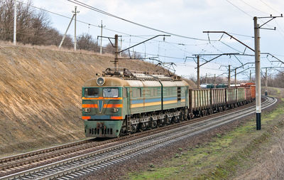 Train on railroad track against sky