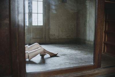 Man lying on floor at home