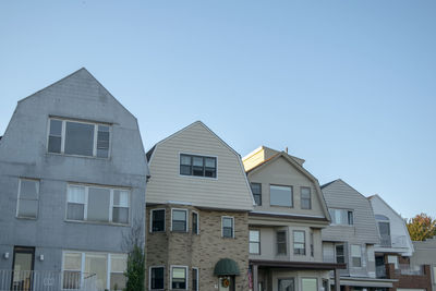 Low angle view of buildings against clear sky
