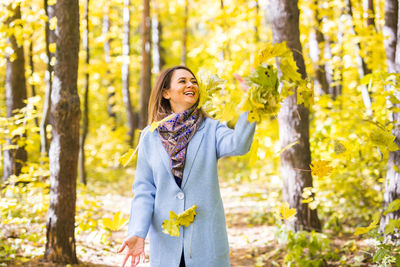 Woman standing in a forest