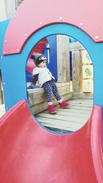 Low angle view of girl in playground