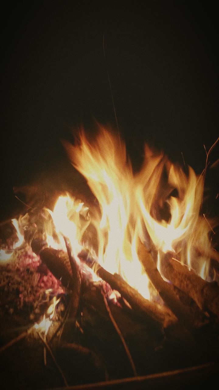 night, burning, illuminated, flame, fire - natural phenomenon, glowing, heat - temperature, light - natural phenomenon, close-up, indoors, dark, motion, fire, bonfire, black background, long exposure, copy space, studio shot, lighting equipment, no people