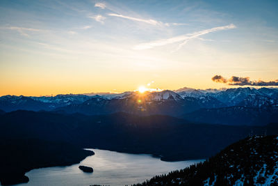 Scenic view of snowcapped mountains against sky during sunset