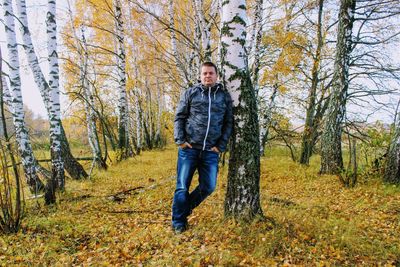 Man standing in forest during autumn