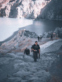 People in snow at mountain during winter