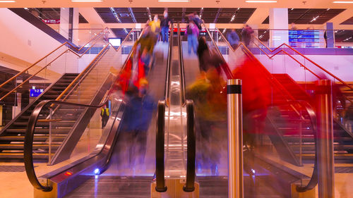 People on escalator at subway station