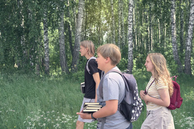 Young couple standing in forest