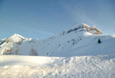 Snow covered mountain against sky