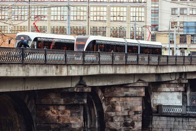 Train against old building in city