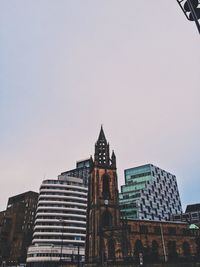 Low angle view of buildings against clear sky