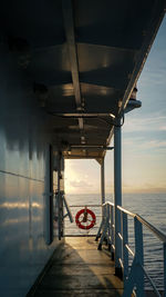 Pier over sea against sky during sunset view from a ferry