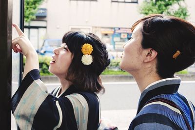 Woman and women looking at camera