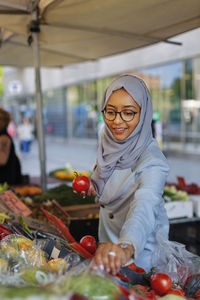 Woman wearing hijab doing shopping