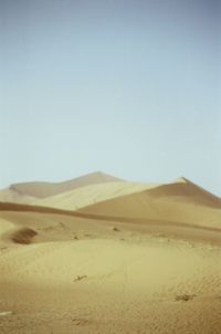 Scenic view of desert against clear sky