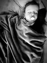 Portrait of cute baby sleeping on bed