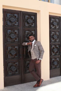 Businessman standing outside building