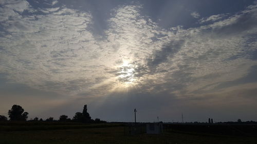 Silhouette landscape against sky