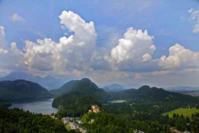 Idyllic shot of green mountains against cloudy sky