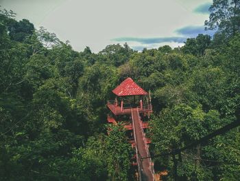 Red gazebo against sky