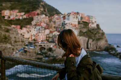 Portrait of young woman looking at sea