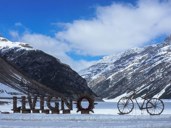 Scenic view of snow covered mountains against sky