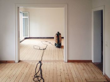 Vacuum cleaner in empty room