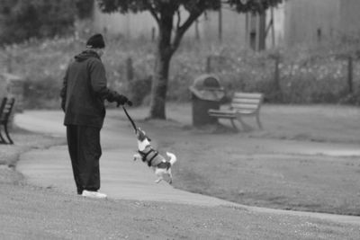 Full length of woman standing on road