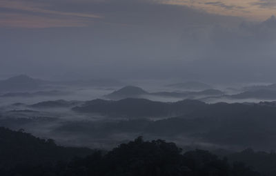 High angle view of trees and mountains against sky