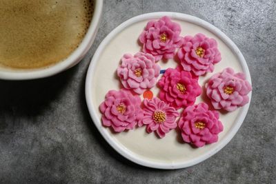 High angle view of pink flowers in bowl on table