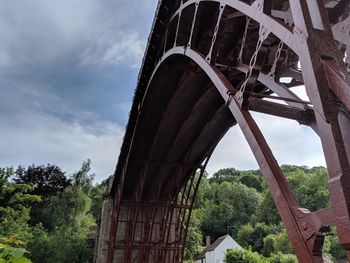 Low angle view of arch bridge against sky