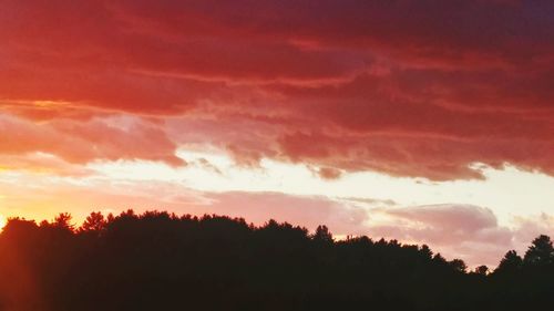 Scenic view of dramatic sky at sunset