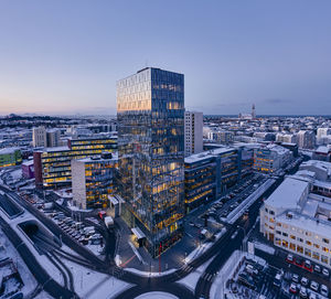 Evening city with modern buildings in winter