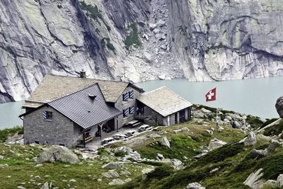 Houses by rocky mountains