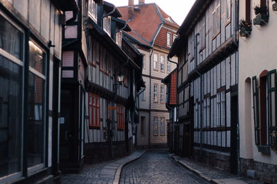 Narrow alley amidst buildings in city
