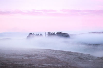 Scenic view of landscape against sky during sunset