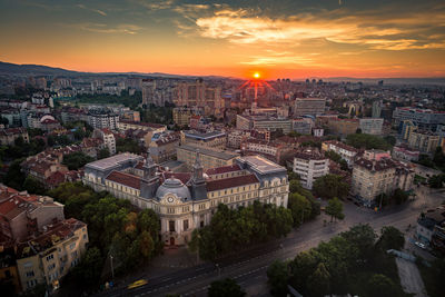 High angle view of city at sunset