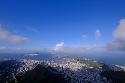 Aerial view of illuminated cityscape against sky