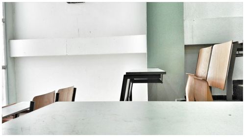 Chair and benches arranged in classroom