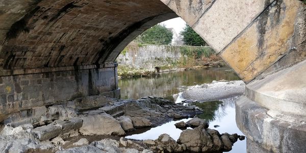 Arch bridge over river