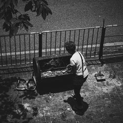 Man standing by tree