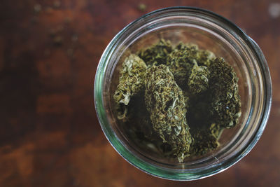 Close-up of plants in glass jar on table