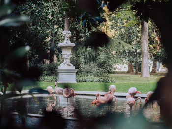 People by statue at park